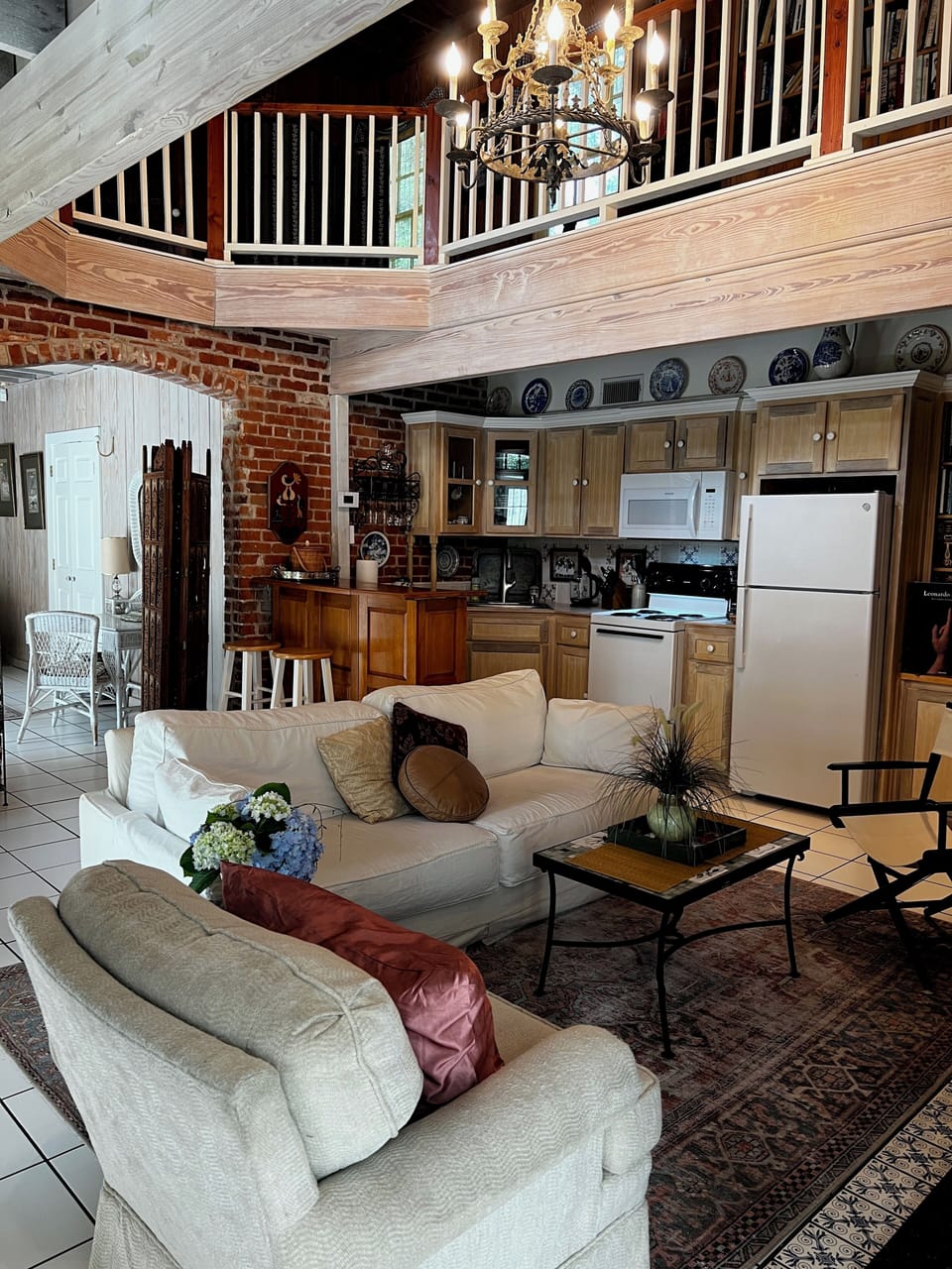 Living room with kitchen in background