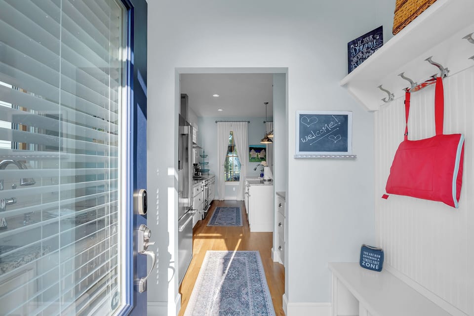 Main/Back entrance to house, has sink and mud room.