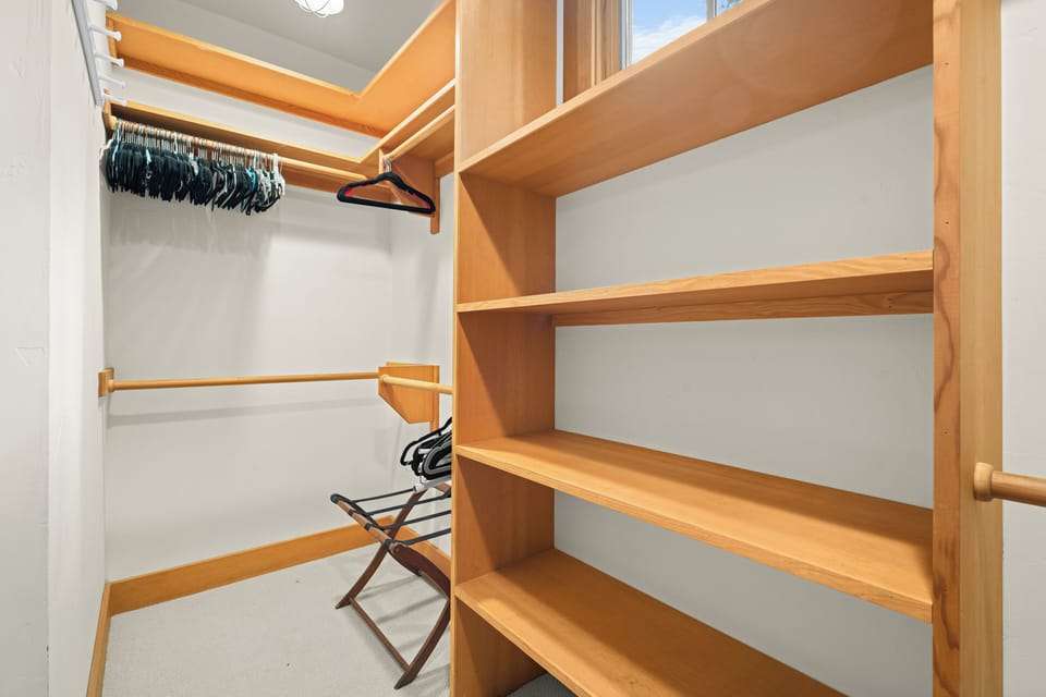Walk in closet in the primary bedroom on the first floor. 