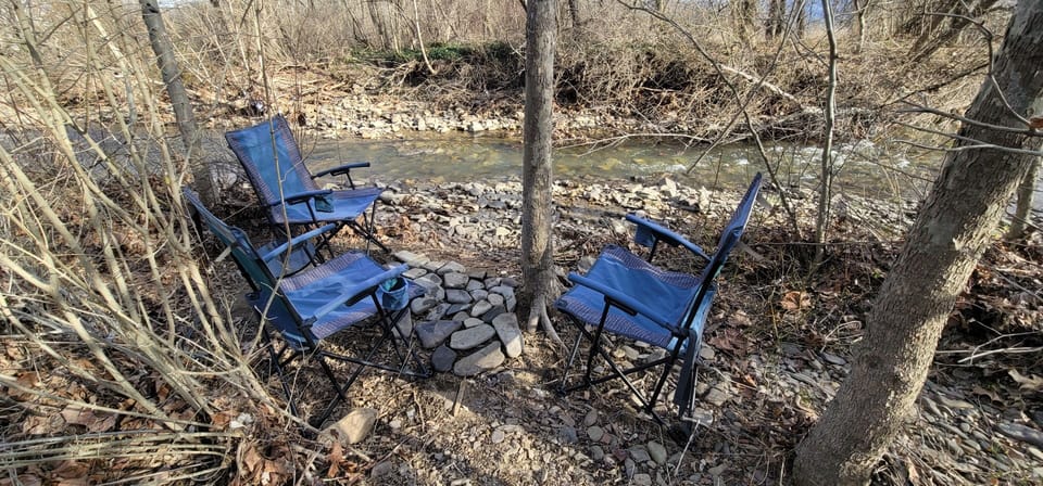 Camp chairs by the river. At times we pick up the chairs due to weather events