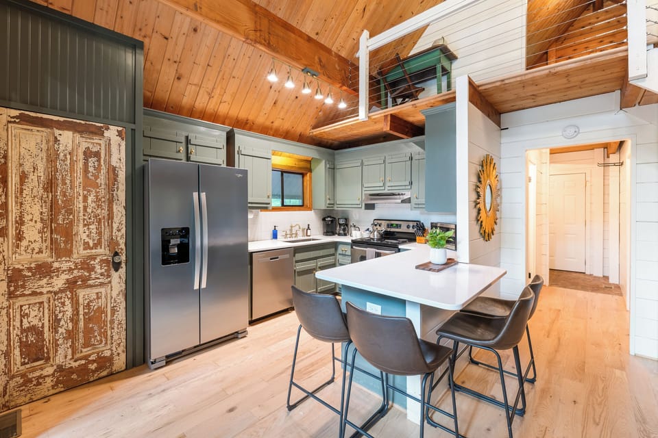 Fully stocked kitchen with pantry and seating for four