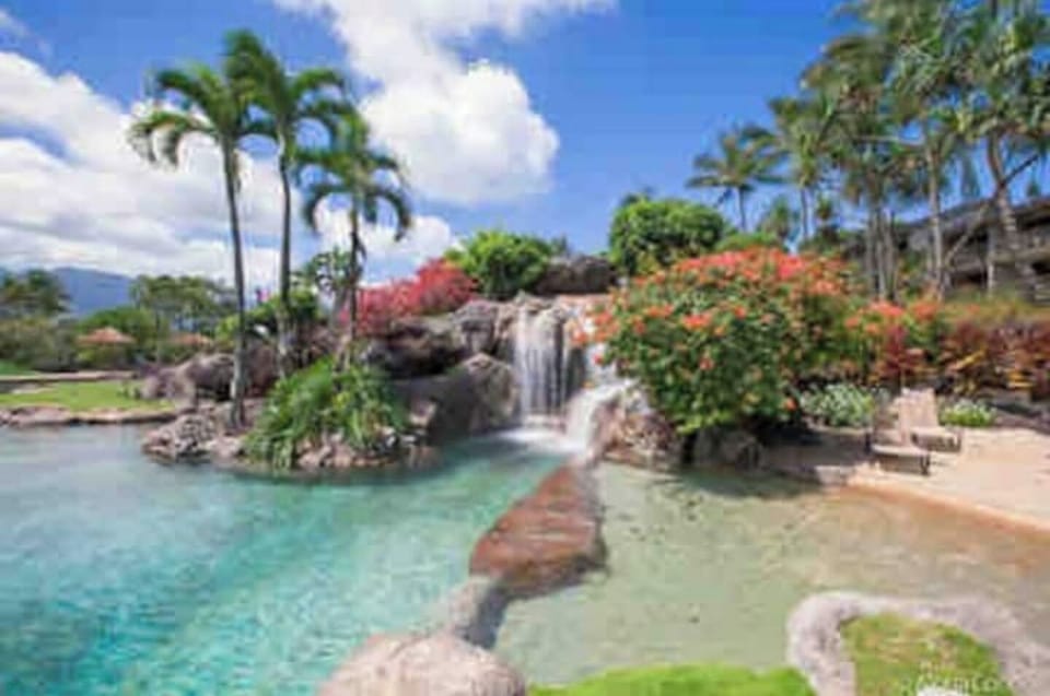 Waterfalls and a sandy bottom pool for the kiddos