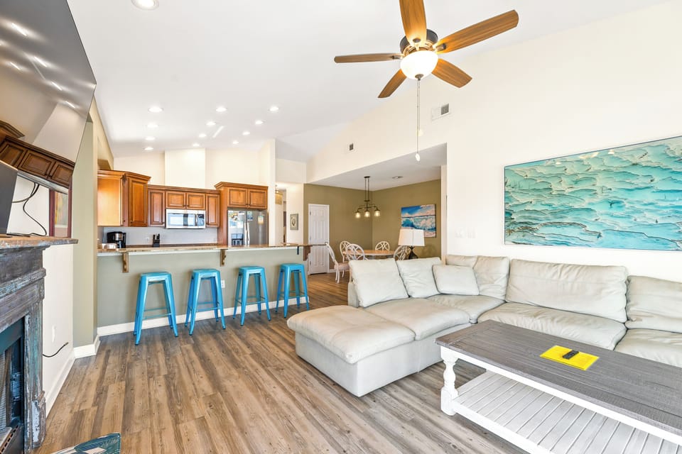 living room with kitchen and dining in view