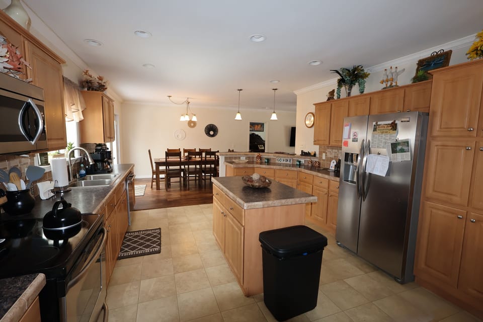 Fully stocked kitchen in Hocking Hills cabin—spacious and perfect for preparing meals.
