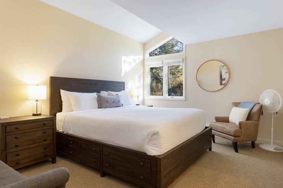 Retreat to the primary suite on the main level, featuring a king bed for the ultimate in comfort.