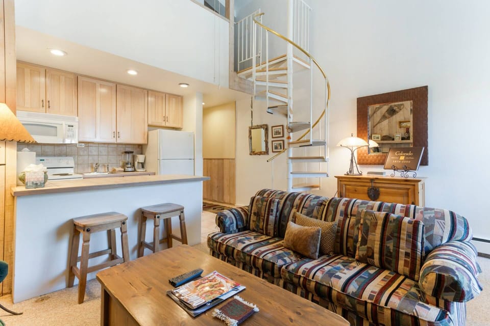The living room features a queen sleeper sofa, perfect for accommodating extra guests.