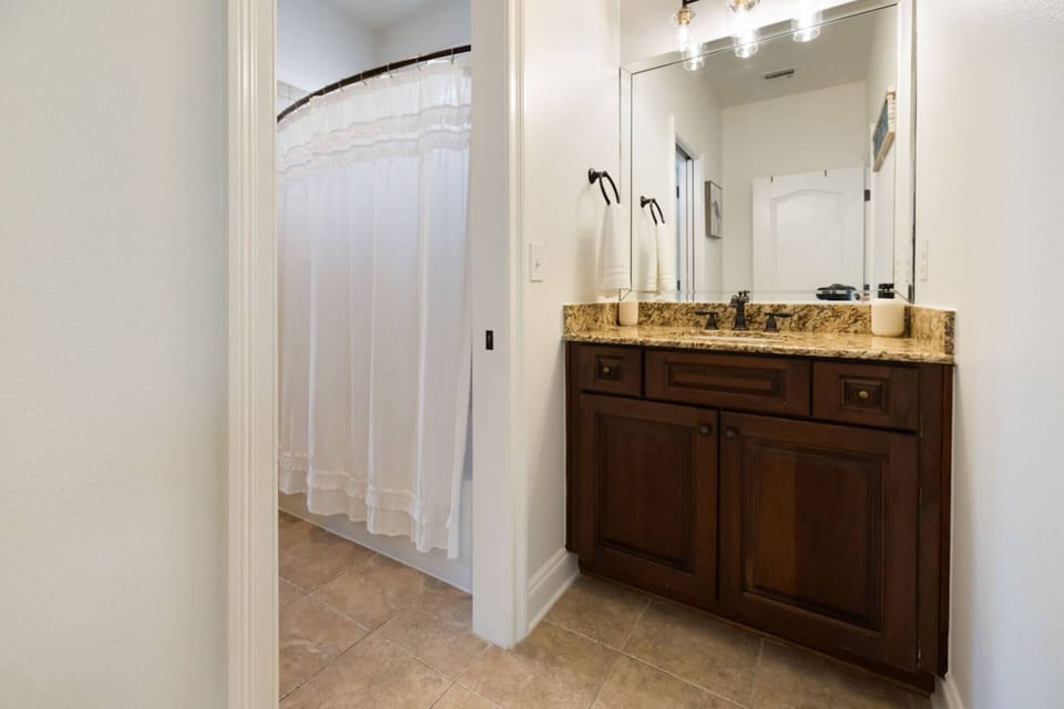 Jack and Jill type bathroom is shared with between the two guest bedrooms on the second floor