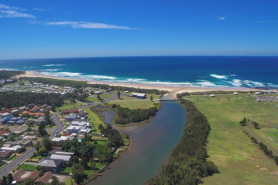 Grab your surfboard, have a beachside picnic, or simply unwind with a sunset stroll along the shore where East Corrimal Beach meets Towradgi Creek.