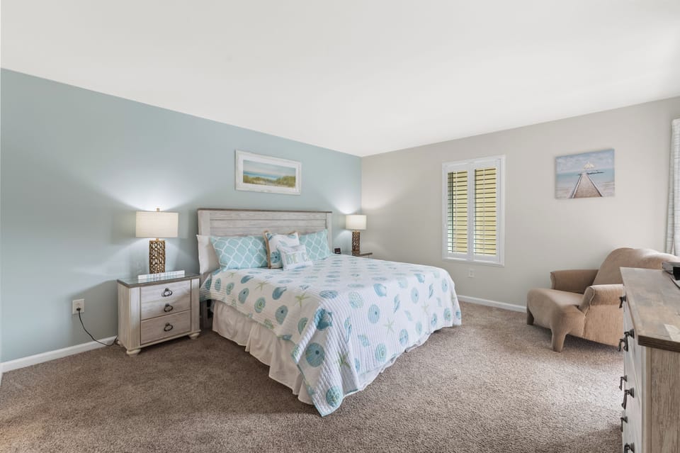 King master bedroom with bath and door to balcony