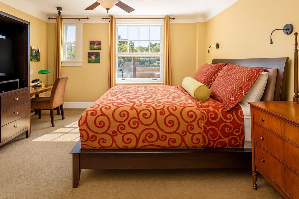Unwind in sunlit comfort with plush bedding and city views.