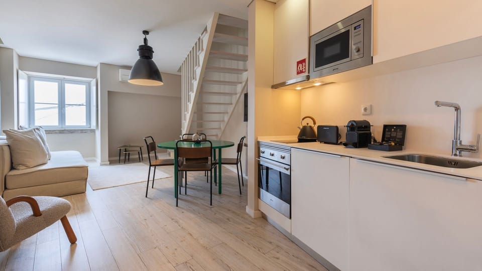A well-equipped kitchenette with high-quality appliances in an open concept living area.
#kitchenette #openconcept #modern #portugal #pt #lisbon