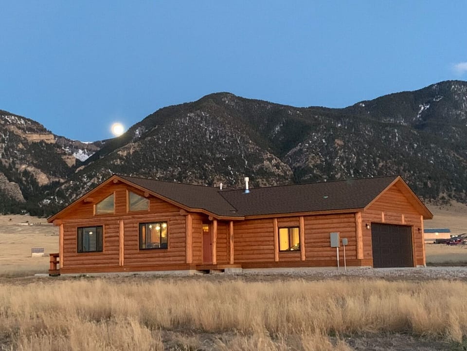 Front of Log Home with Madison mountain range in the background