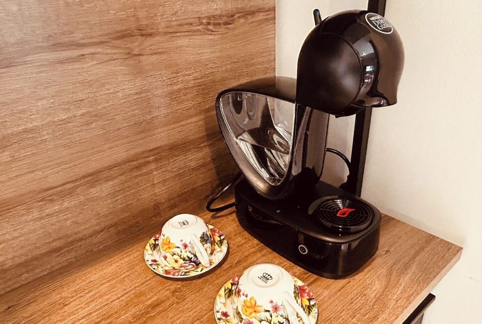wooden counter with two small, delicate cups.