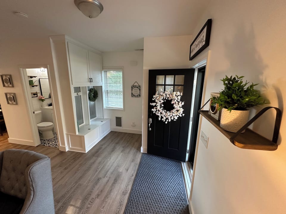 Entry with place to hang jackets and peak into the main level half bathroom.