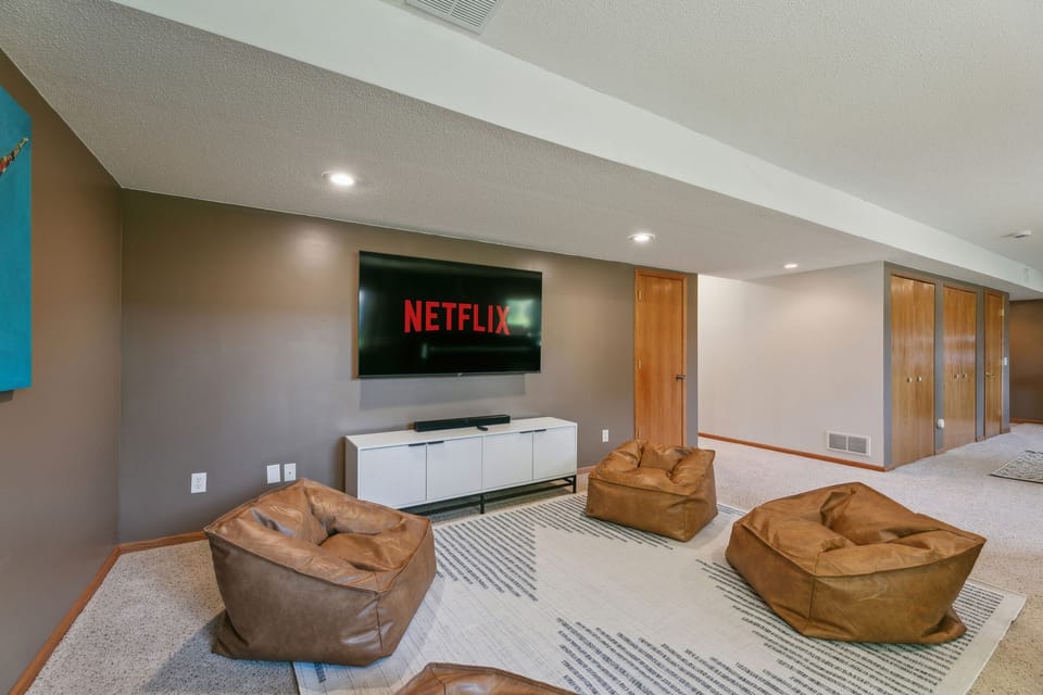 The Bunk room features full-size arcade games and a massive 70" TV.