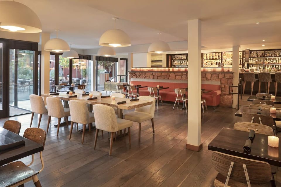 Gather for relaxed dining in a stylish, warmly lit restaurant.
