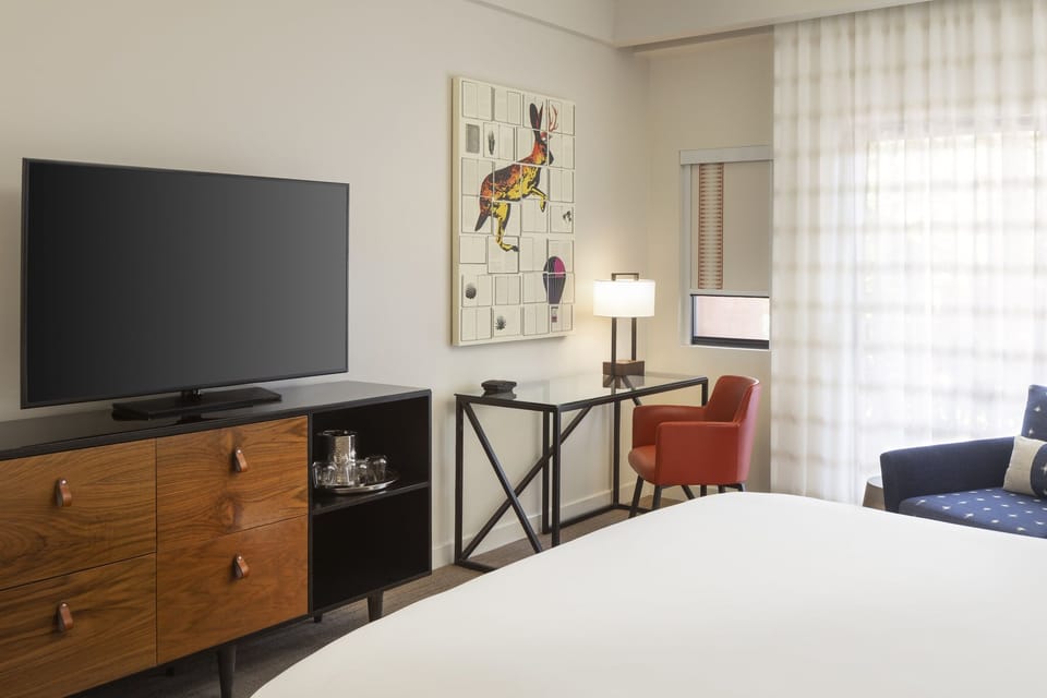 Ease into your stay with a dedicated workspace and lounge chair.