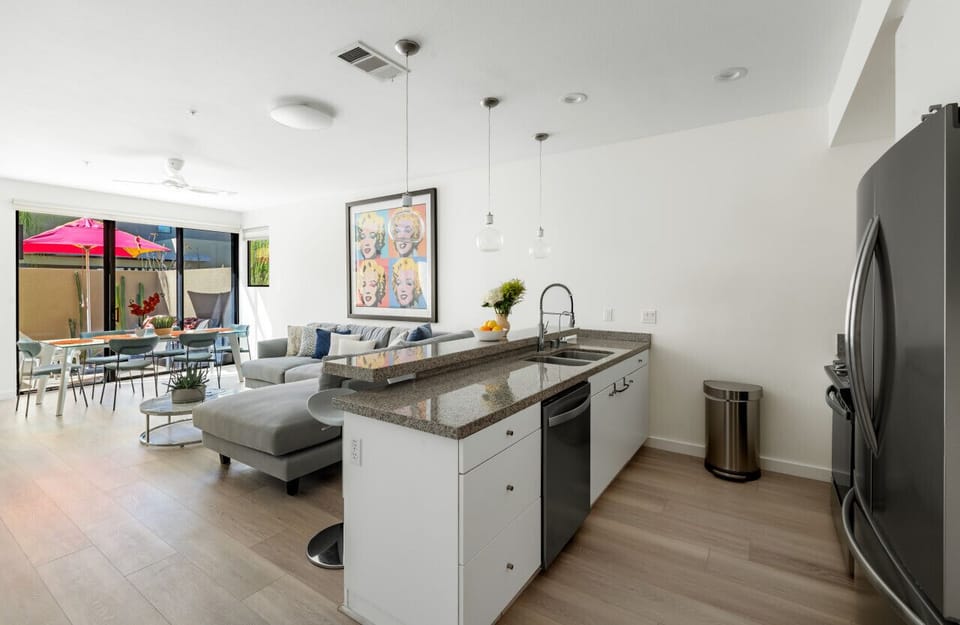 Sophisticated & Spacious 🌿 A seamless blend of modern design and cozy touches, this sunlit home offers an inviting living space, a sleek kitchen, and eye-catching artwork for a vibrant stay.