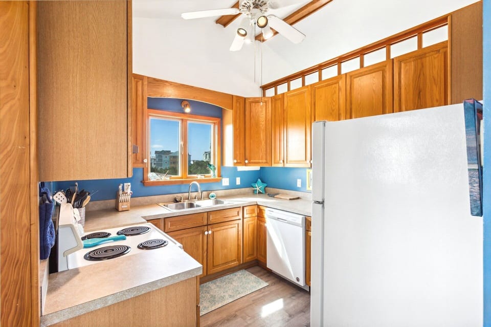 The fully equipped Kitchen offers everything you need to prepare delicious meals with 9' of counter space next to the refrigerator with an ice maker.