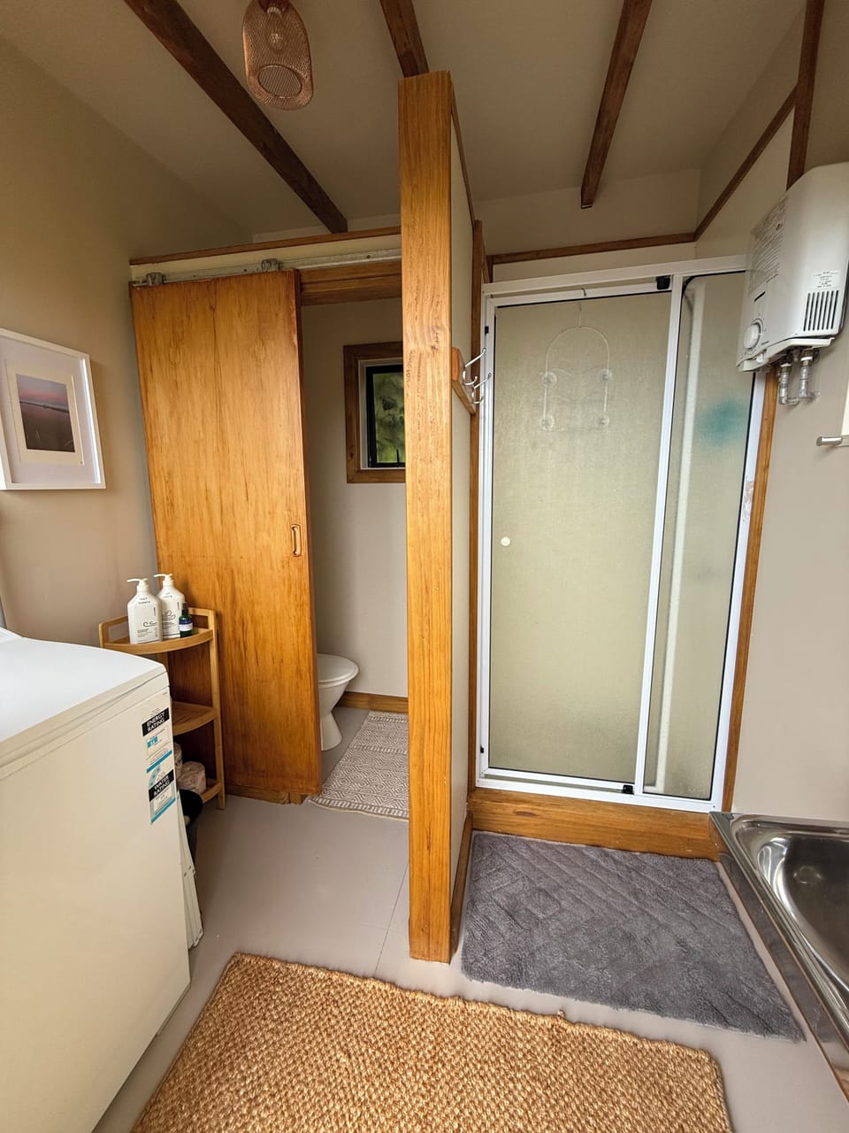 Shared bathroom unit interior (toilet, hot shower & washing machine)