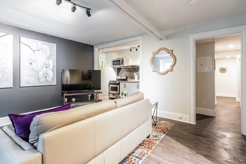 Comfortable Living Area With Smart TV And Easy Access To The Kitchen