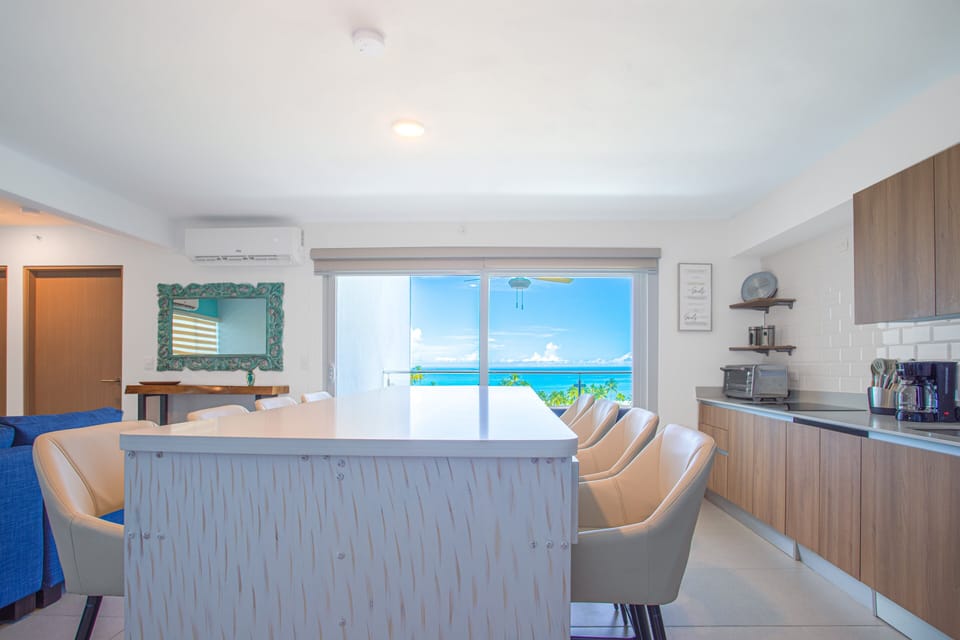 Bright and breezy—turquoise decor and magnificent sea views just steps from the sand.