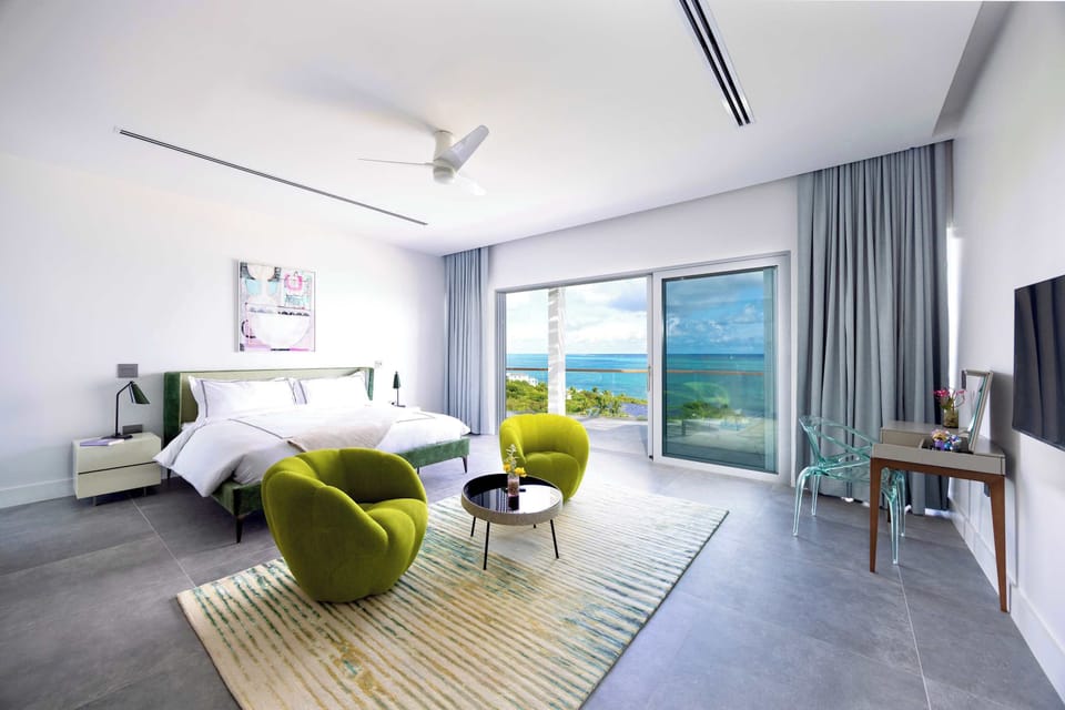 Elevated King Oceanview Suite with Designer Roche Bobois Furnishings and ensuite bathroom