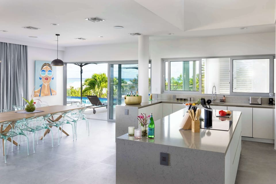 Oceanview dining styled with designer pieces from the Roche Bobois collection