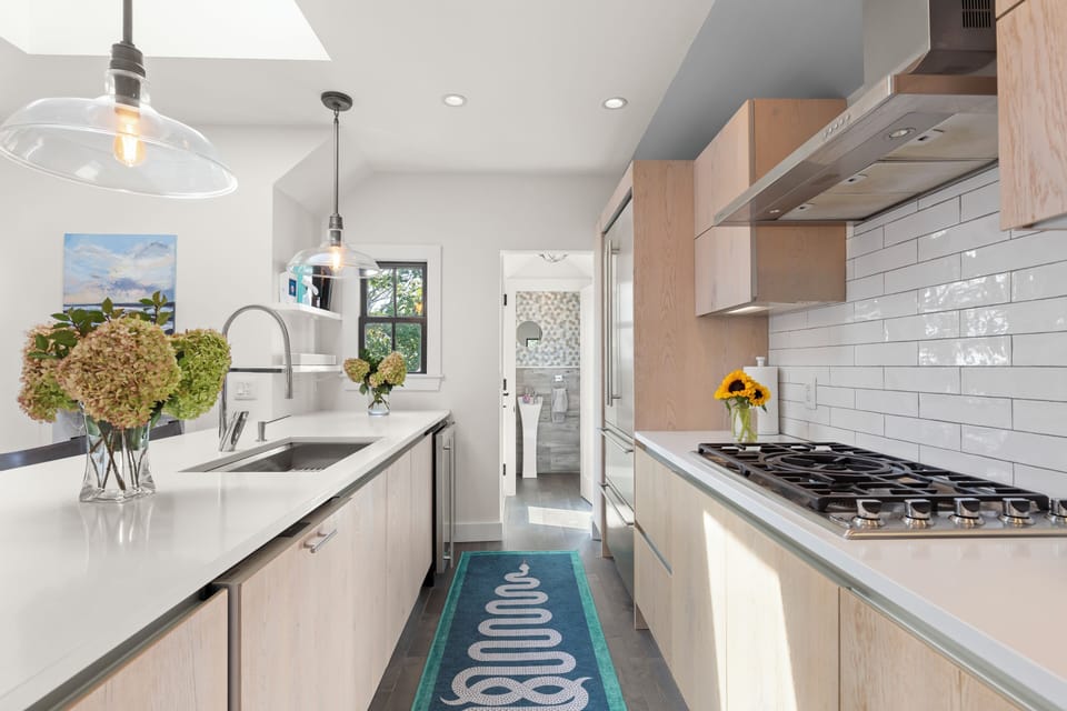 Cook easily with stainless steel appliances, double ovens, and a range hood.