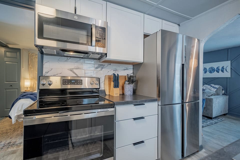 - Modern kitchen featuring stainless appliances and a clean updated cooking area   - Smooth counters and organized essentials make meal prep simple for guests   - Ideal setup for travelers wanting a ready to use functional kitchen
