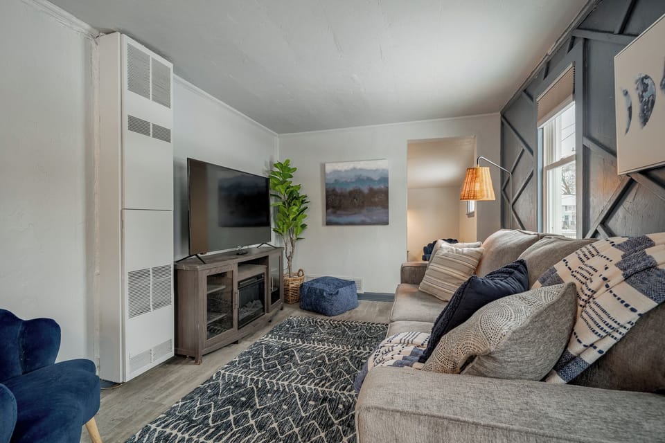 - Cozy living room with comfy seating stylish accents and a large smart TV for guests   - Soft textures and warm lighting create a relaxing stay ready for movie nights   - Perfect lounge space for unwinding after exploring local attractions