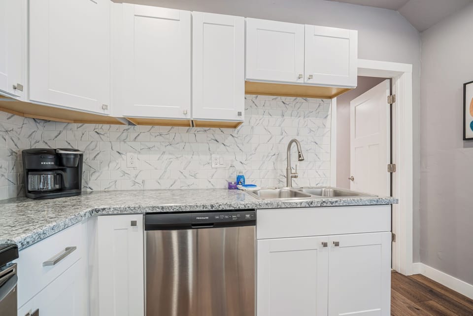 Dishwasher in fully stocked kitchen