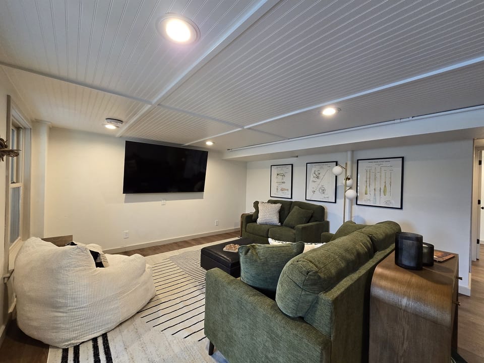 - Relax in this cozy living room with plush seating   - Enjoy the big-screen TV and bright inviting layout   - Perfect lounge spot for movie nights and group fun