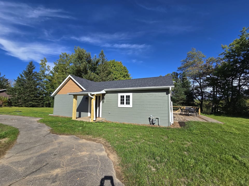 - Charming home exterior with fresh open yard views   - Peaceful setting offering privacy and easy access   - Ideal home base for relaxing stays and outdoor fun