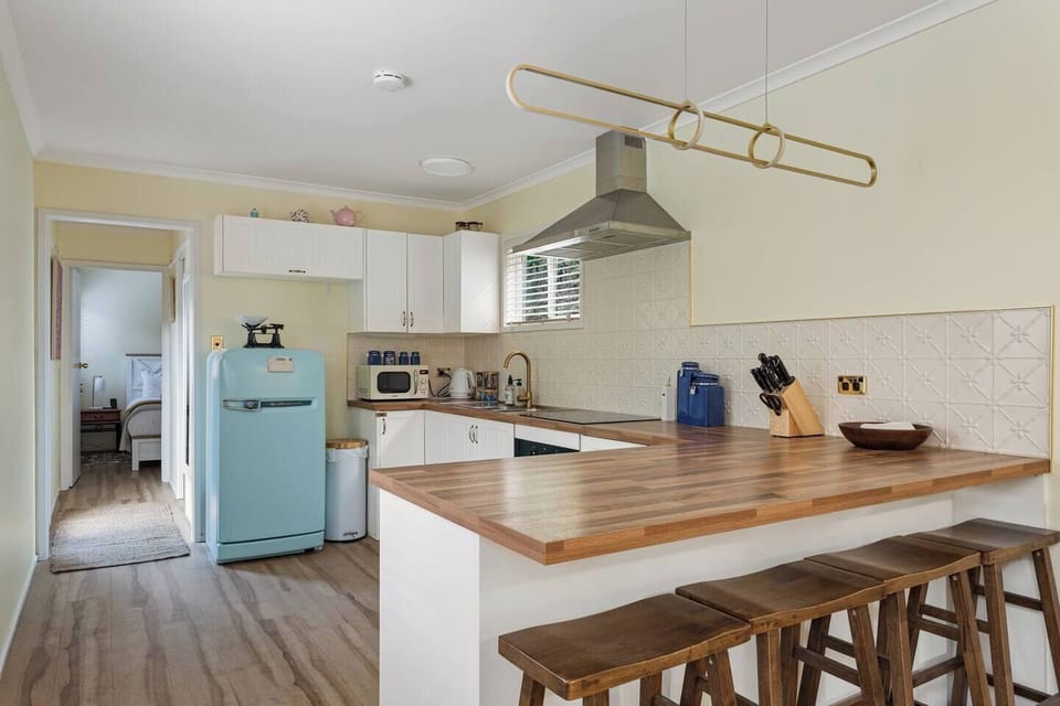 The kitchen has a retro cool style whilst also being stocked with contemporary appliances and amenities that will ensure you have everything required to cook up a storm.
