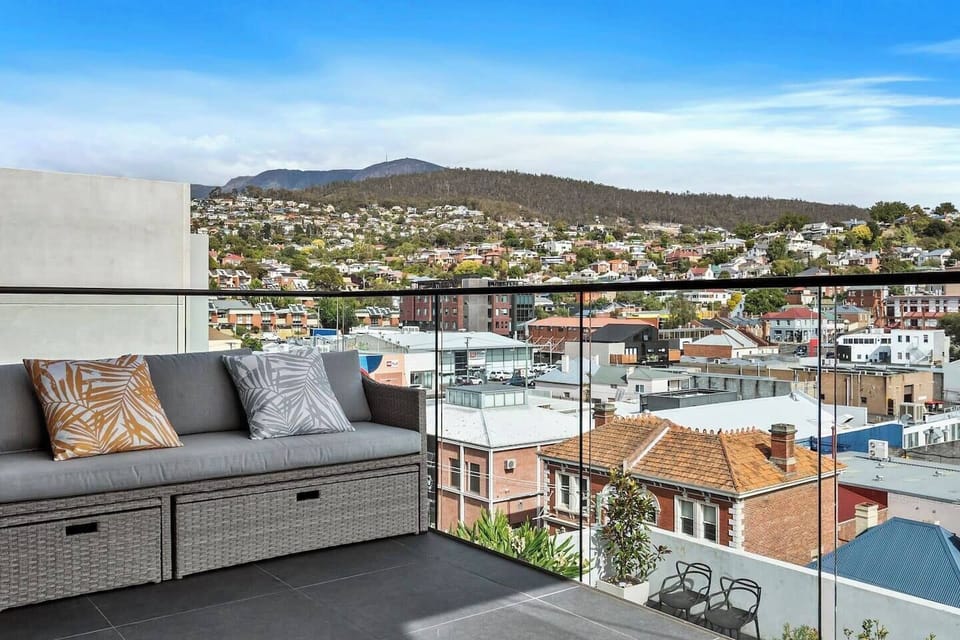 Enjoy breathtaking views of Kunanyi/Mount Wellington from the sunny north-facing balcony, perfect for relaxation and unwinding.