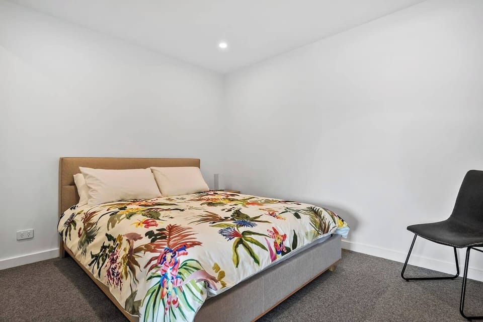 The second bedroom offers a cosy queen bed, providing a serene and comfortable space.