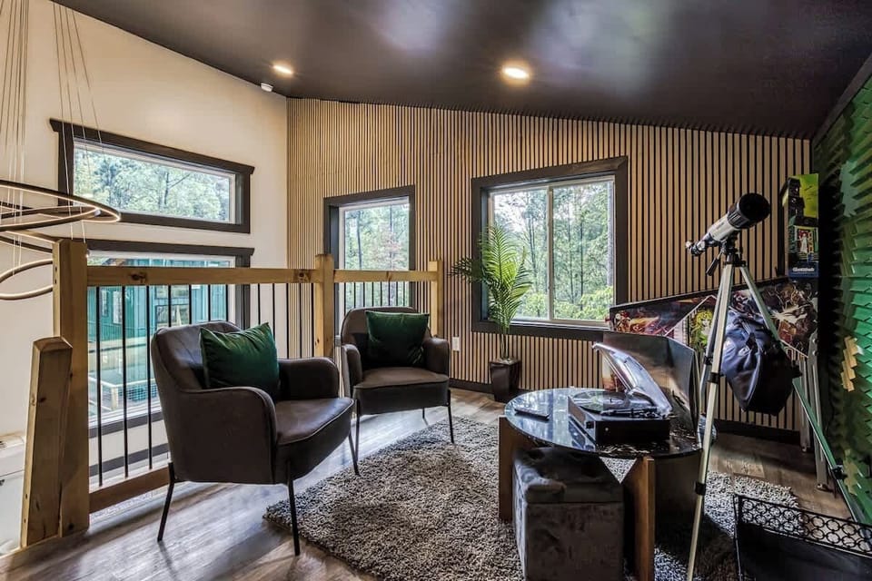 Beautiful loft views with a pinball machine and a telescope just in case you want to catch the beautiful stars above!