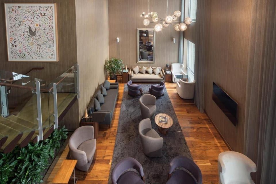 Admire the dramatic atrium lounge from above—bright and airy.