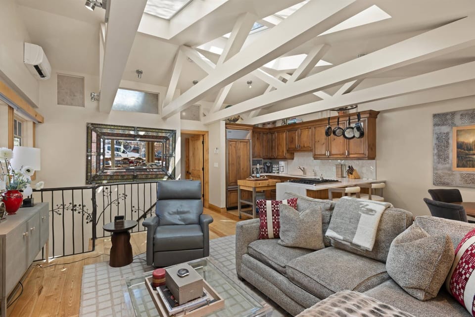 The living room is a perfect mix of natural light and coziness