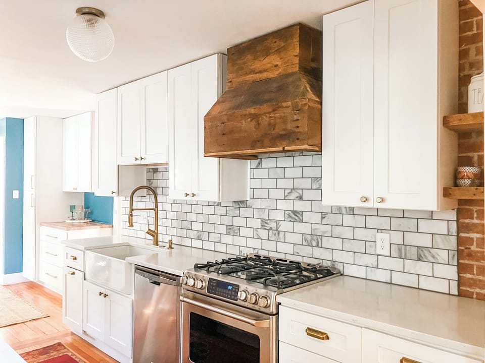 Full kitchen with bar area behind
