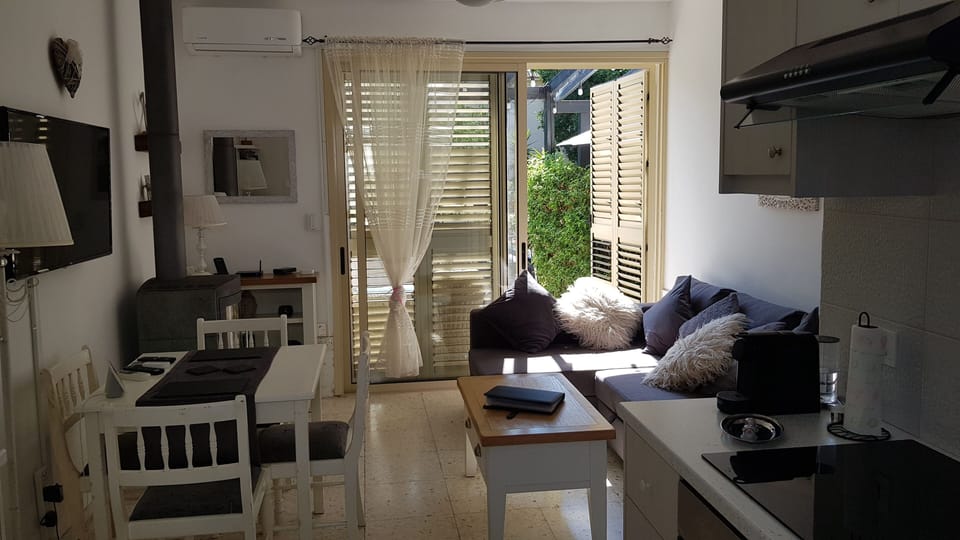 Relax in the open-plan living area, then step out to your private garden retreat