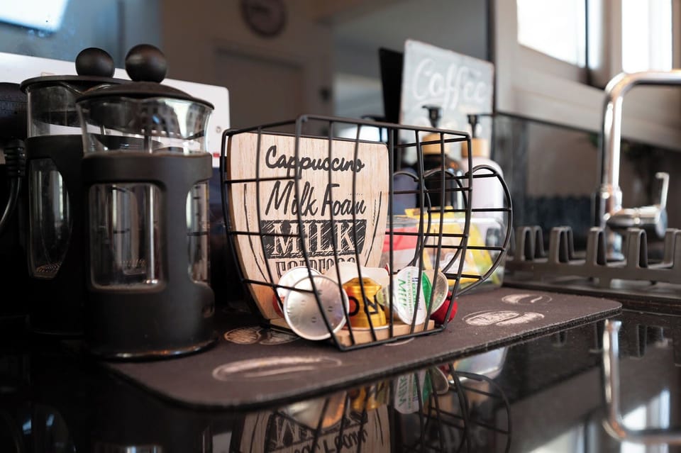 Coffee station with Nespresso machine, coffee pods and a selection of teas