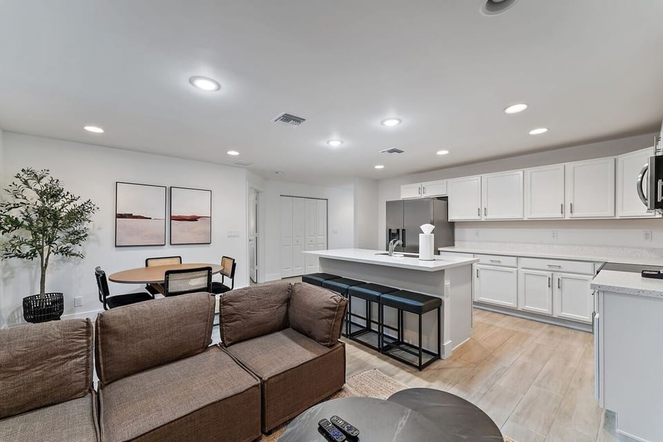 Living room with comfortable couch & big flat screen smart TV