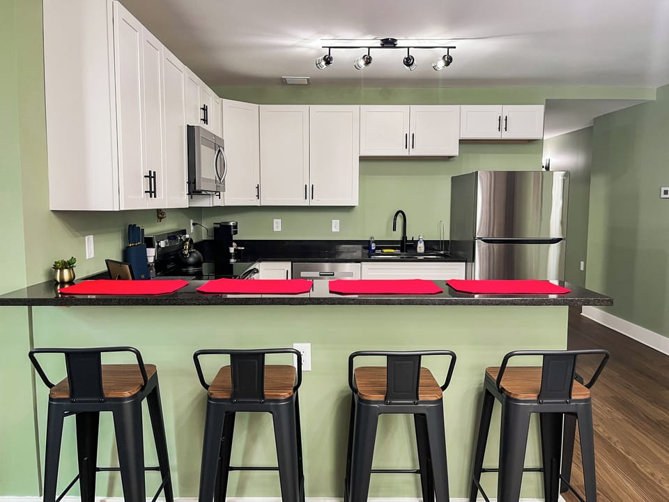 Eat in kitchen with bar seating and open floor plan.