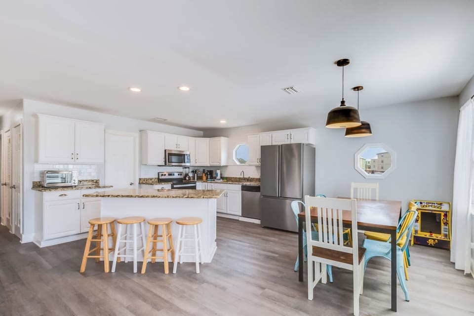 This is a picture of the kitchen in the Sel de Vie vacation rental. The kitchen is large and fully stocked with everything you need to cook and serve meals.