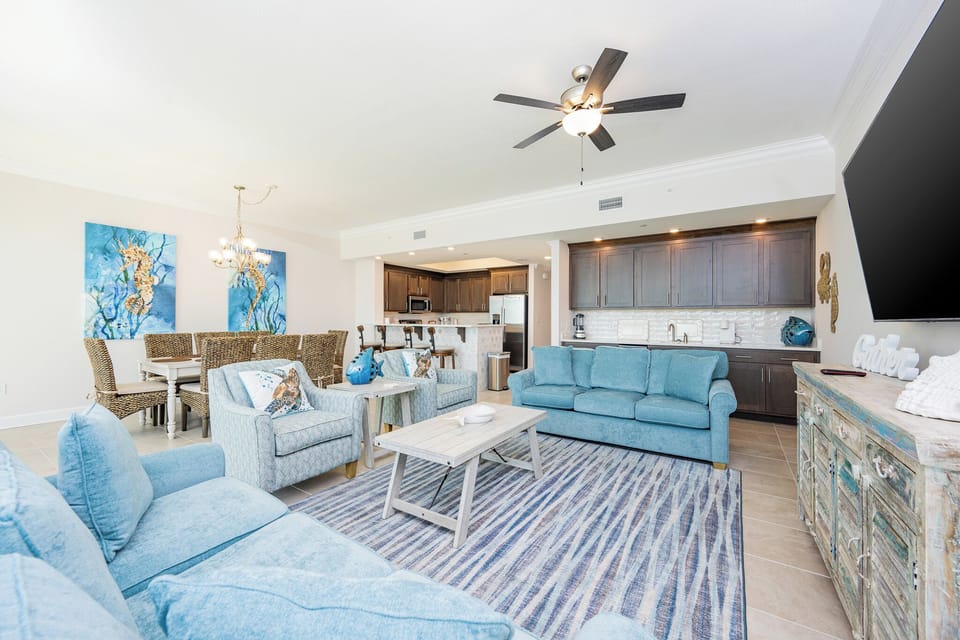Gather in this welcoming living space and enjoy the fun coastal decor and fun colorful accents