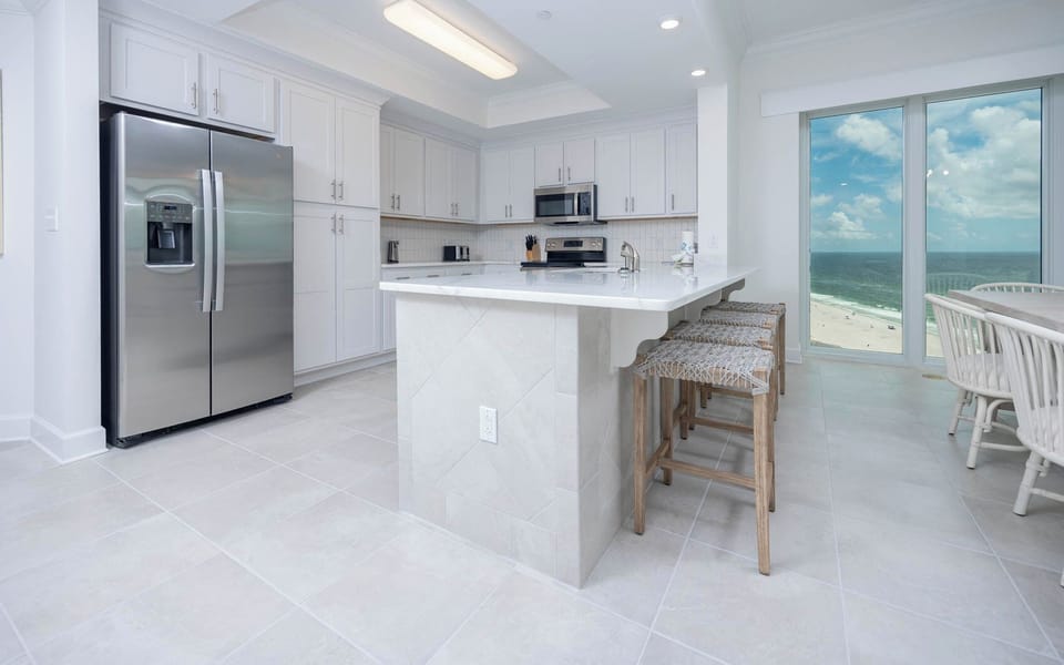 Wake up with morning coffee at the breakfast bar and get ready for a beach day in this stylish space