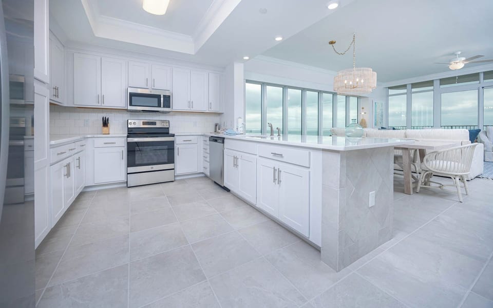 Prepare meals in this kitchen with elegant cabinetry, stainless appliances, and spacious countertops