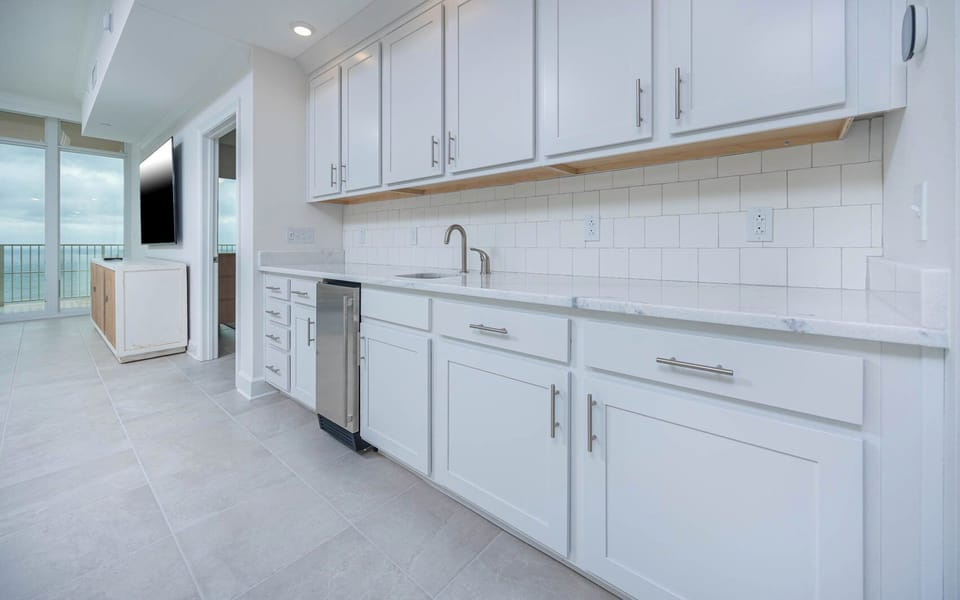 Grab a chilled drink from the fridge or create your favorite cocktail at the wet bar